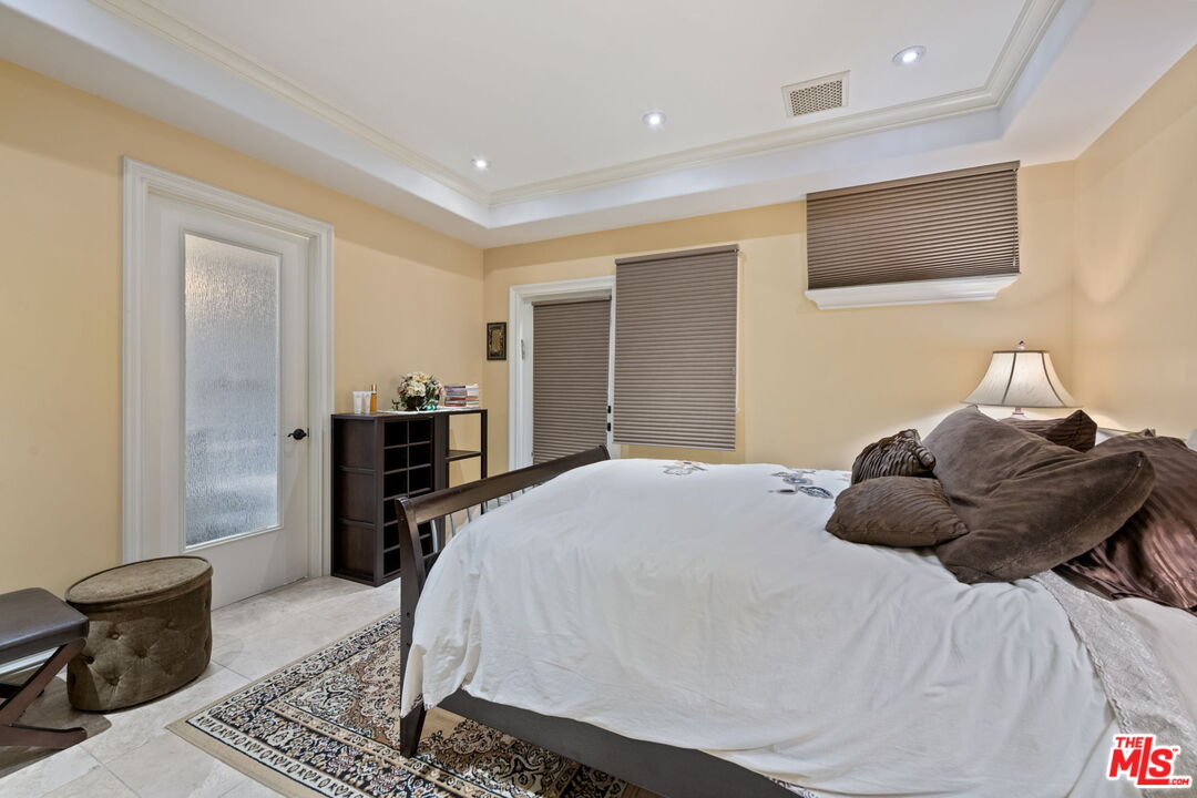 2023 Parnell Avenue Los Angeles, CA 90025 - Photo 48 of 59 a bedroom with a bed and wooden floor