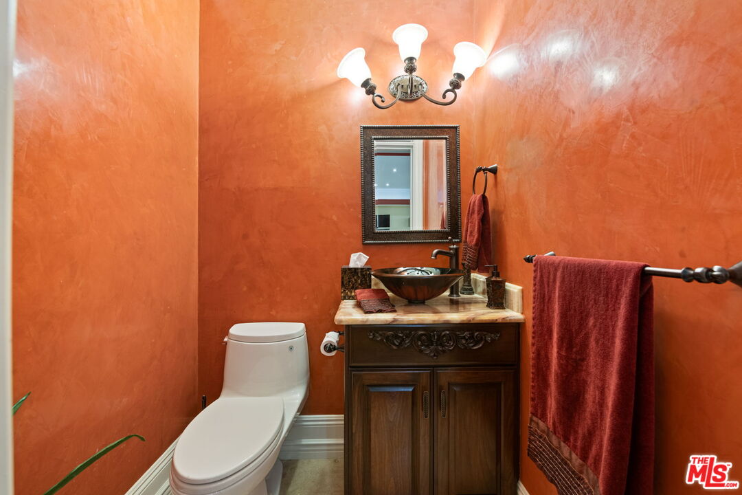 2023 Parnell Avenue Los Angeles, CA 90025 - Photo 50 of 59 a bathroom with a toilet a sink and mirror