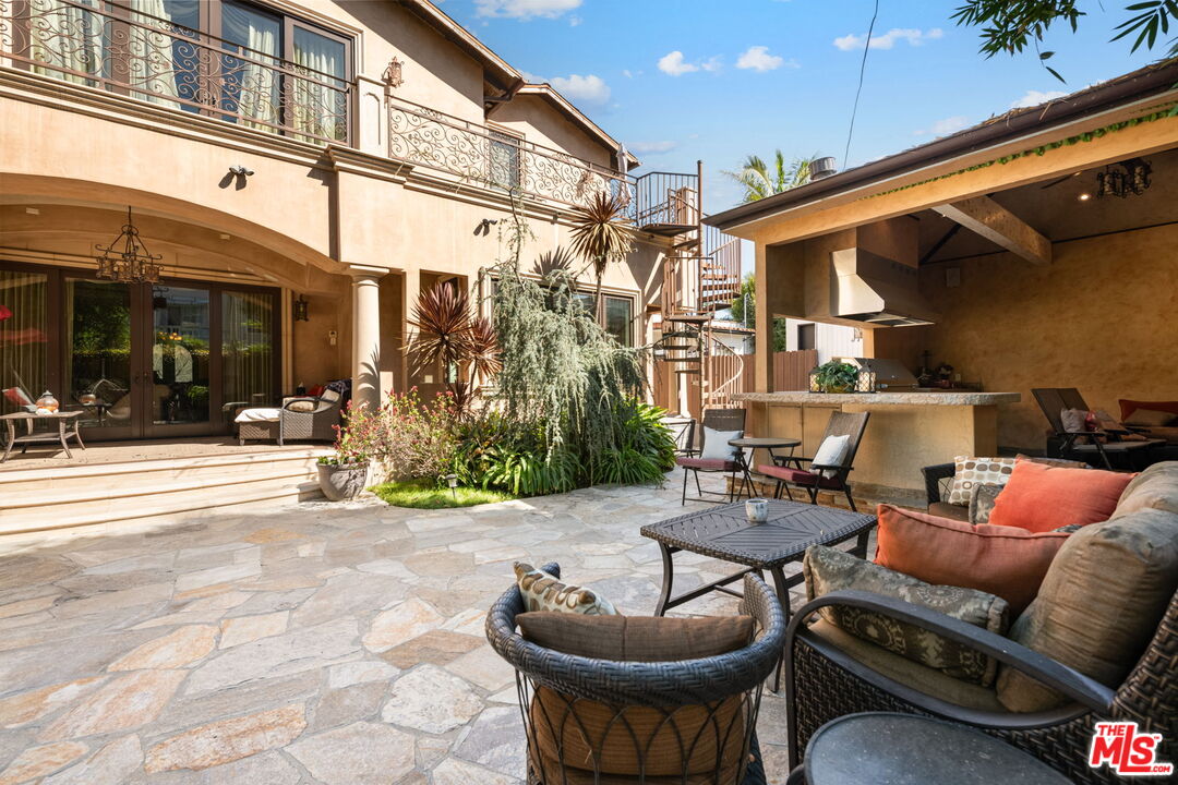 2023 Parnell Avenue Los Angeles, CA 90025 - Photo 56 of 59 a patio with a table and chairs