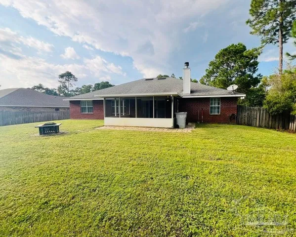 a view of a house with swimming pool and porch with furniture