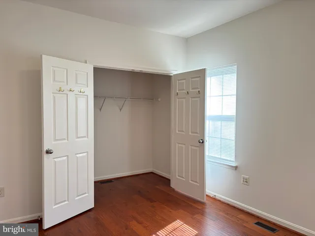 a bathroom with a toilet a sink and a mirror
