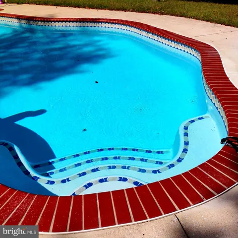 a view of a house with a swimming pool