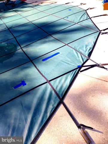 a bathroom with a shower and a glass door