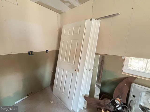 a view of a hallway with stairs