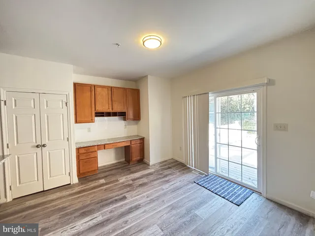 wooden floor and windows in a room with a window