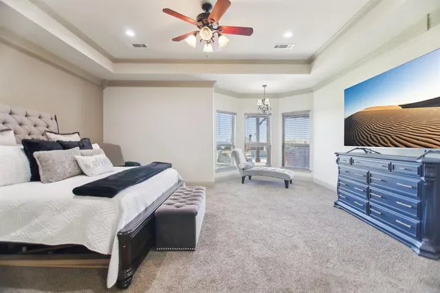 a bed room with a bed and a chair