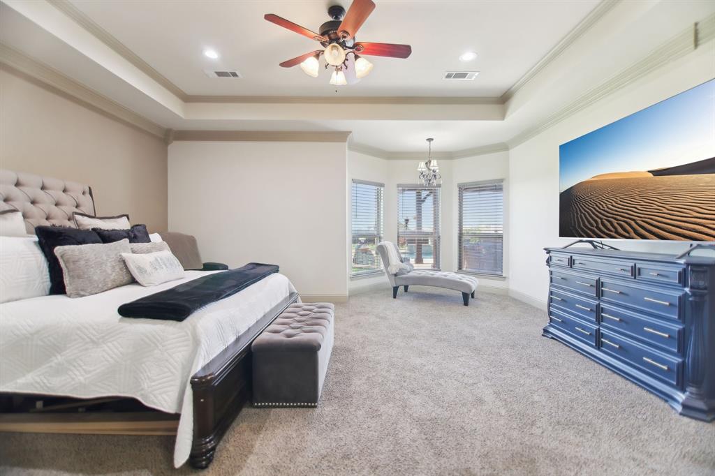 15110 Rutledge Lane Talty, TX 75126 - Photo 15 of 40 a bed room with a bed and a chair