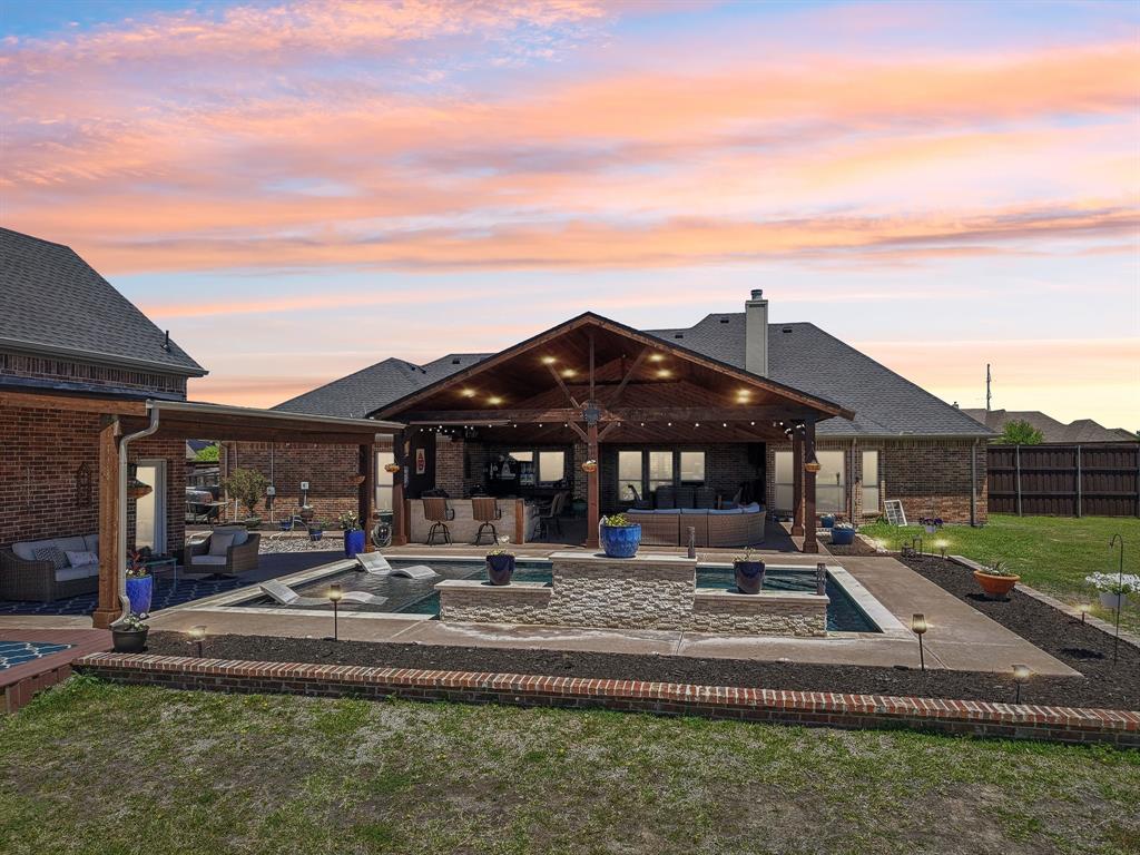 15110 Rutledge Lane Talty, TX 75126 - Photo 2 of 40 a front view of a house with garden