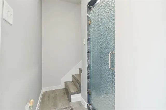 a view of staircase with white walls