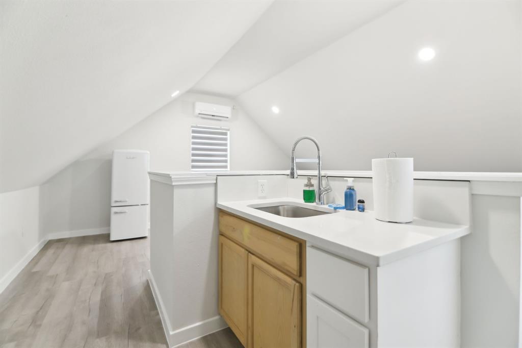 15110 Rutledge Lane Talty, TX 75126 - Photo 25 of 40 a kitchen with a sink a stove and cabinets