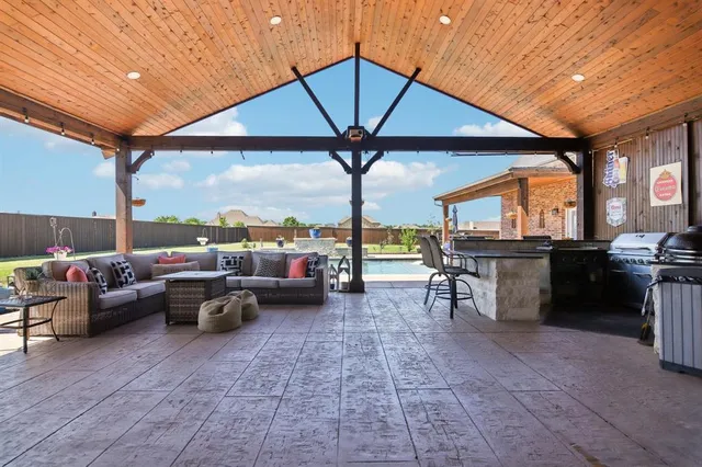 a view of a patio with a table chairs and a patio