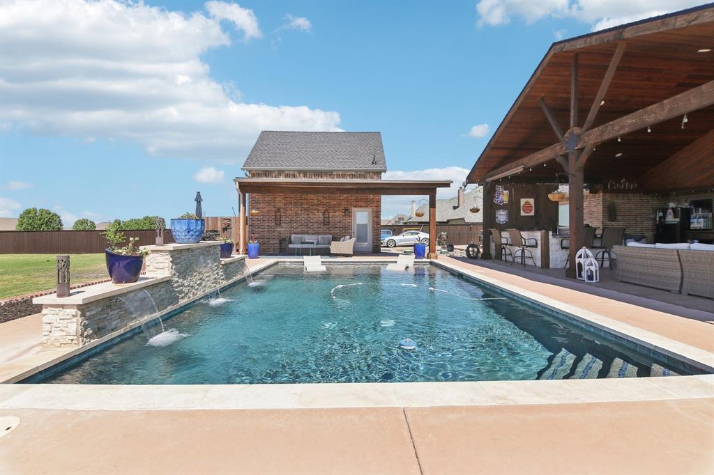 15110 Rutledge Lane Talty, TX 75126 - Photo 33 of 40 a view of a swimming pool with an outdoor seating