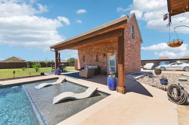 a view of a couches and dinning table in patio