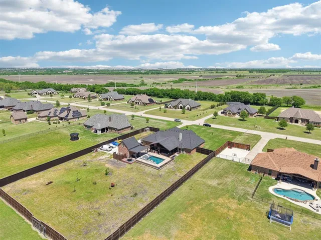 an aerial view of a pool patio swimming pool and outdoor seating