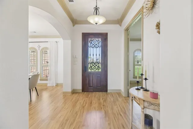 a view of an entryway with wooden floor