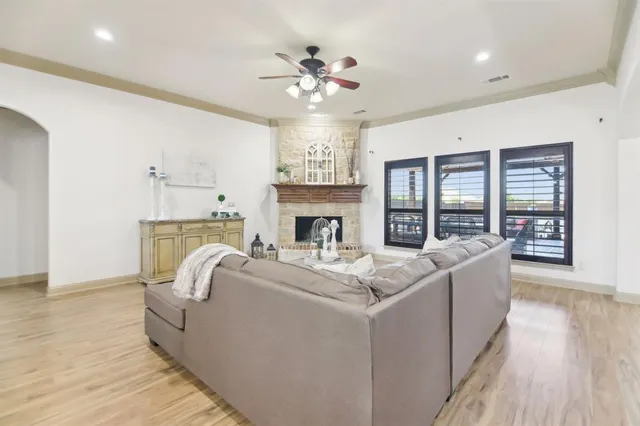 a living room with furniture and a fireplace