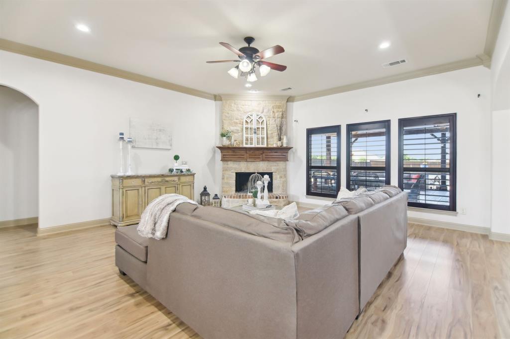 15110 Rutledge Lane Talty, TX 75126 - Photo 5 of 40 a living room with furniture and a fireplace