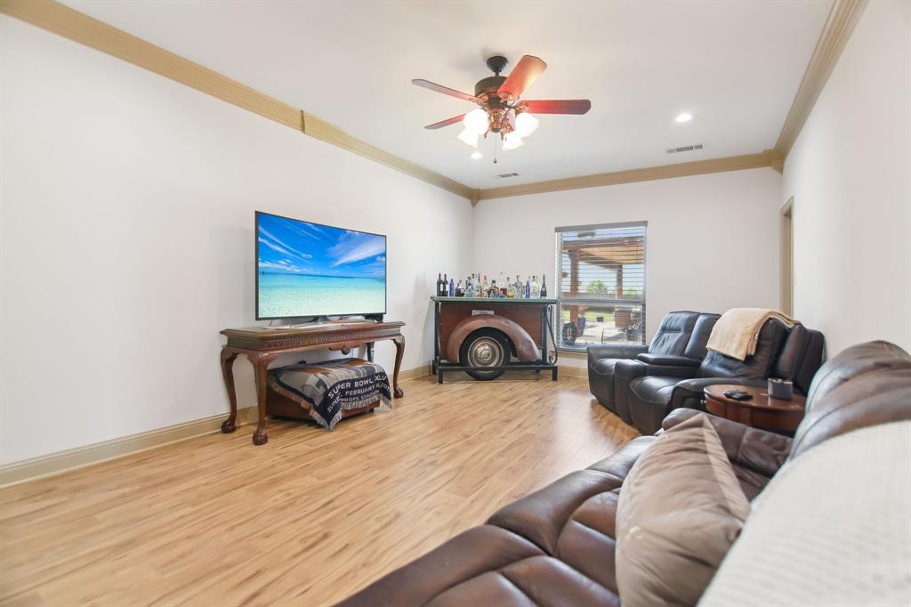 15110 Rutledge Lane Talty, TX 75126 - Photo 8 of 40 a living room with furniture and a flat screen tv