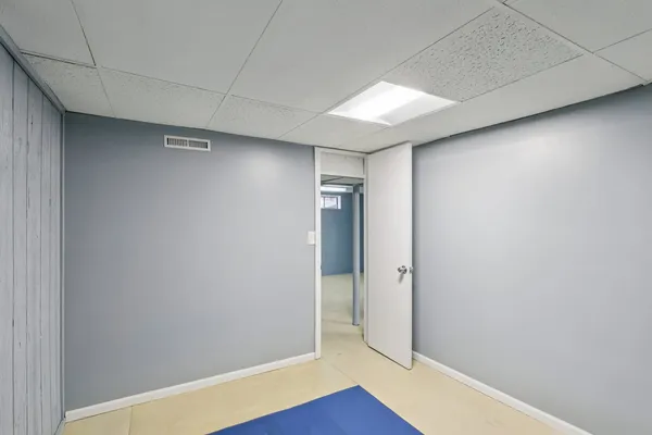 an empty room with wooden floor