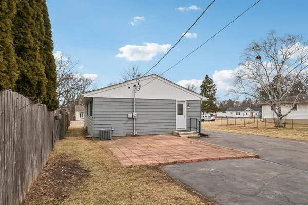 a view of a house with a yard and garage