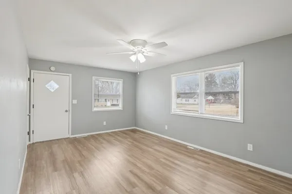 a view of an empty room with a window
