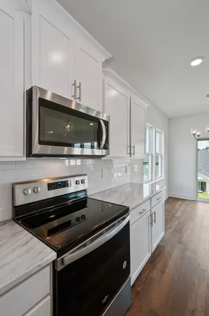 a kitchen with a stove and a microwave