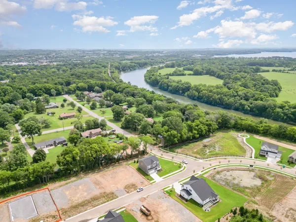 a view of a lake with a yard
