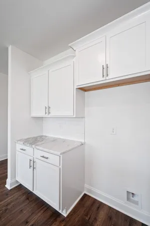 a view of cabinets with wooden floor