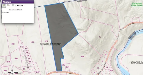 a view of a backyard of the house