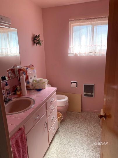 1302 South Mahan Street Ridgecrest, CA 93555 - Photo 10 of 17 a bathroom with a sink and toilet