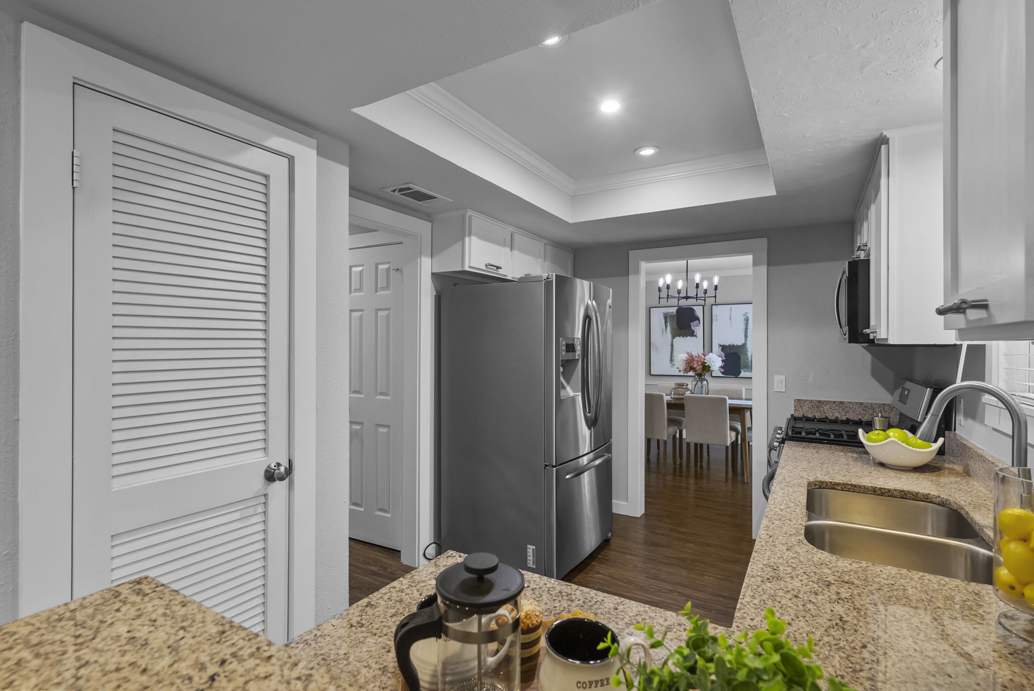 11405 Pyreneese Drive Austin, TX 78759 - Photo 8 of 37 a kitchen with stainless steel appliances granite countertop a refrigerator and a sink