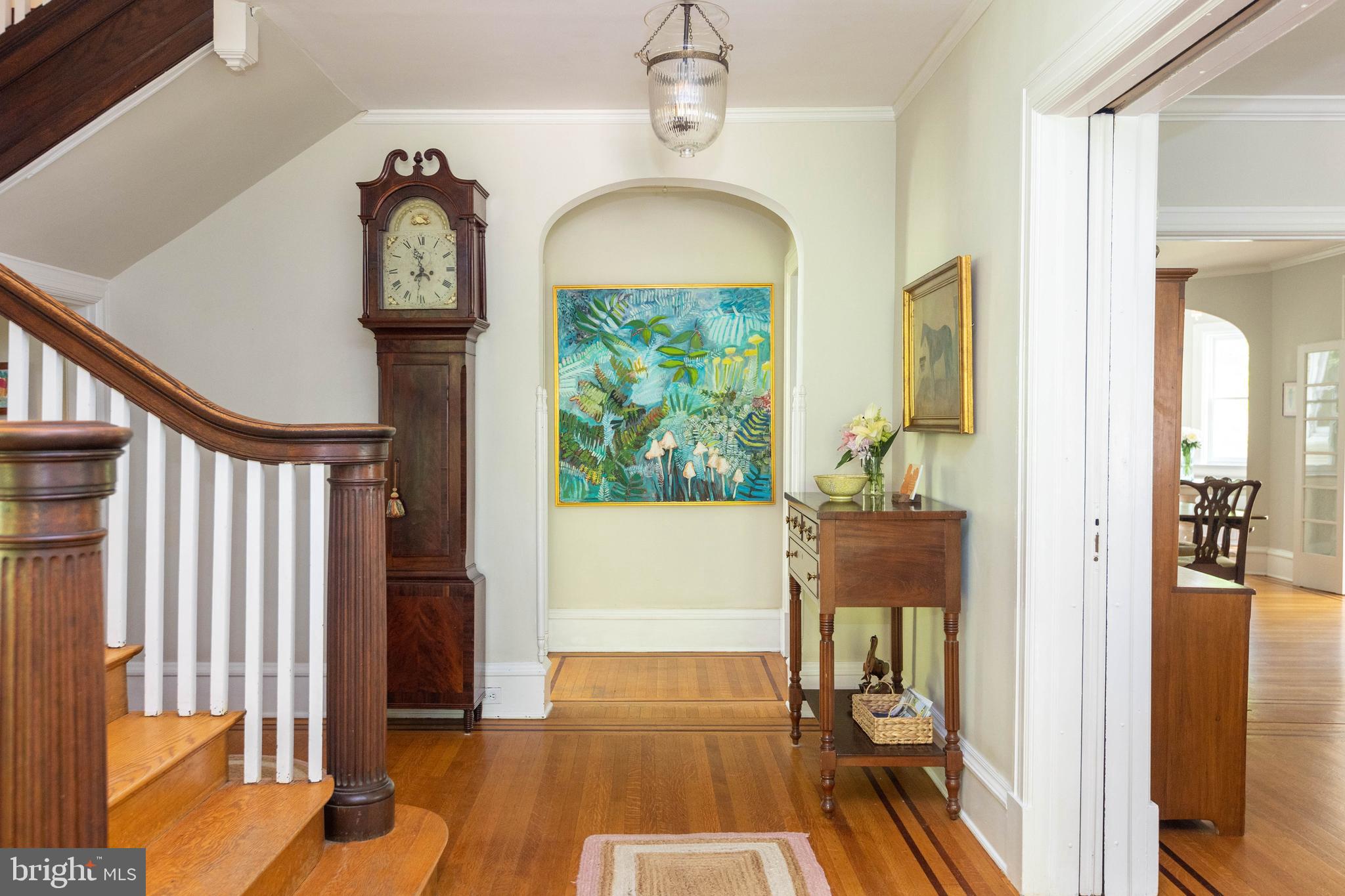 4711 Roland Avenue Baltimore, MD 21210 - Photo 13 of 68 a view of a hallway with wooden floor and staircase