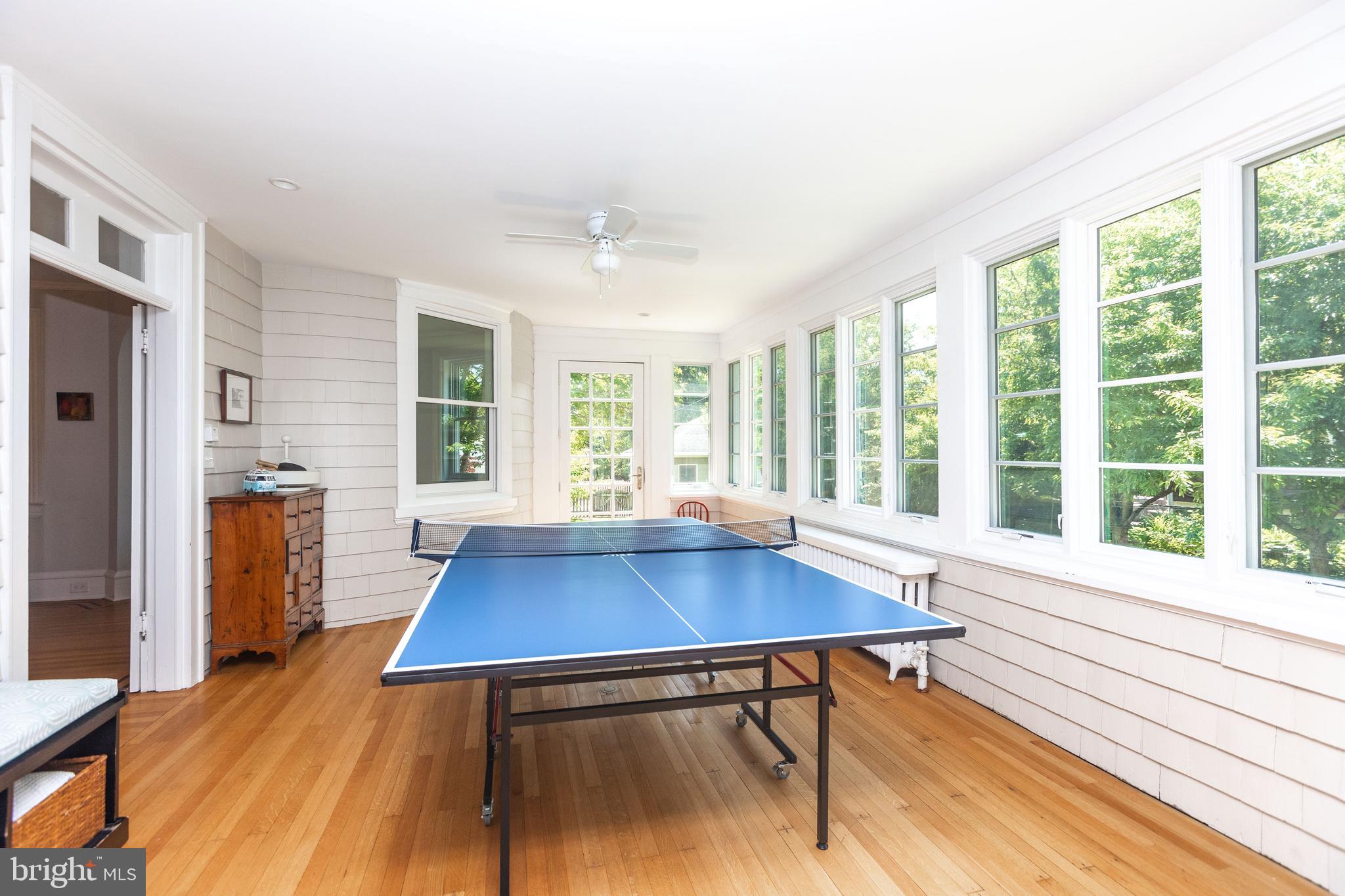 4711 Roland Avenue Baltimore, MD 21210 - Photo 21 of 68 a view of a dining room with furniture window and wooden floor