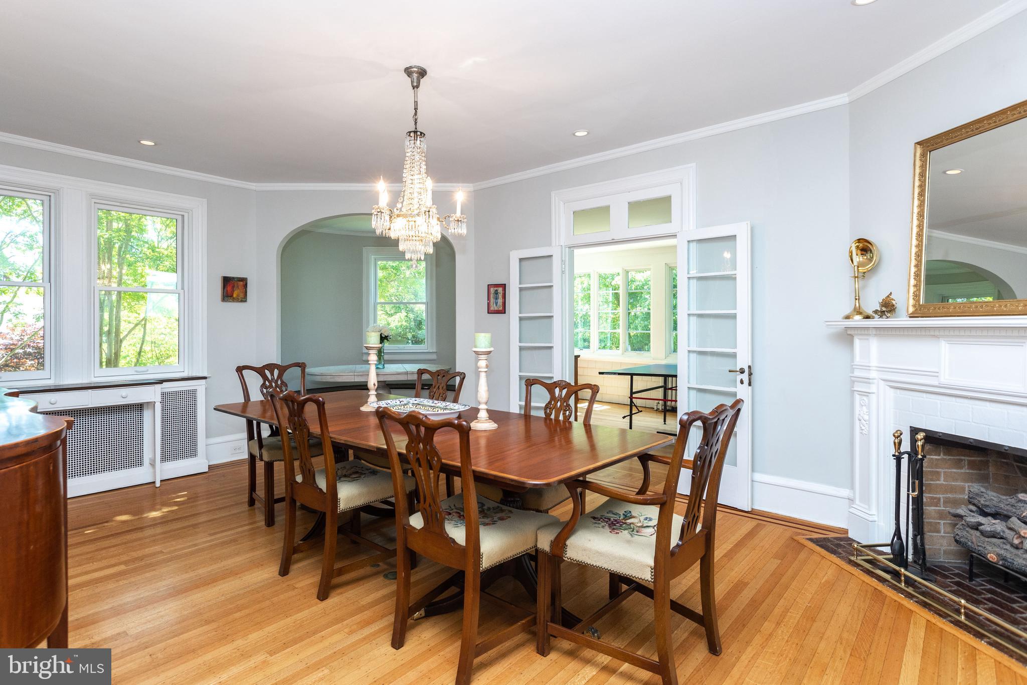 4711 Roland Avenue Baltimore, MD 21210 - Photo 22 of 68 a view of a dining room with furniture window and wooden floor