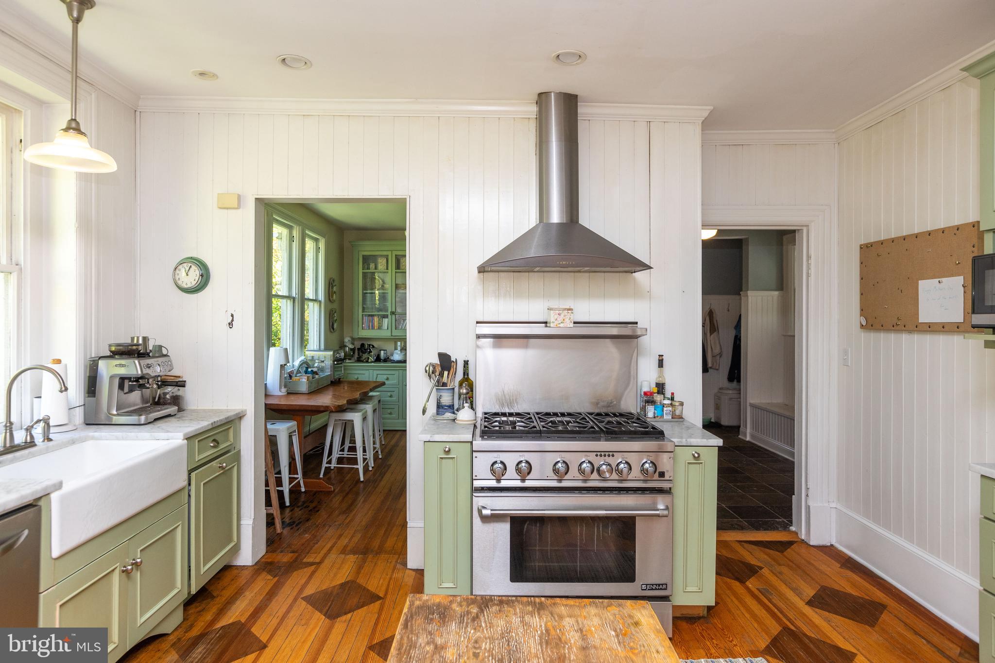 4711 Roland Avenue Baltimore, MD 21210 - Photo 25 of 68 a kitchen with a stove and a wooden floors