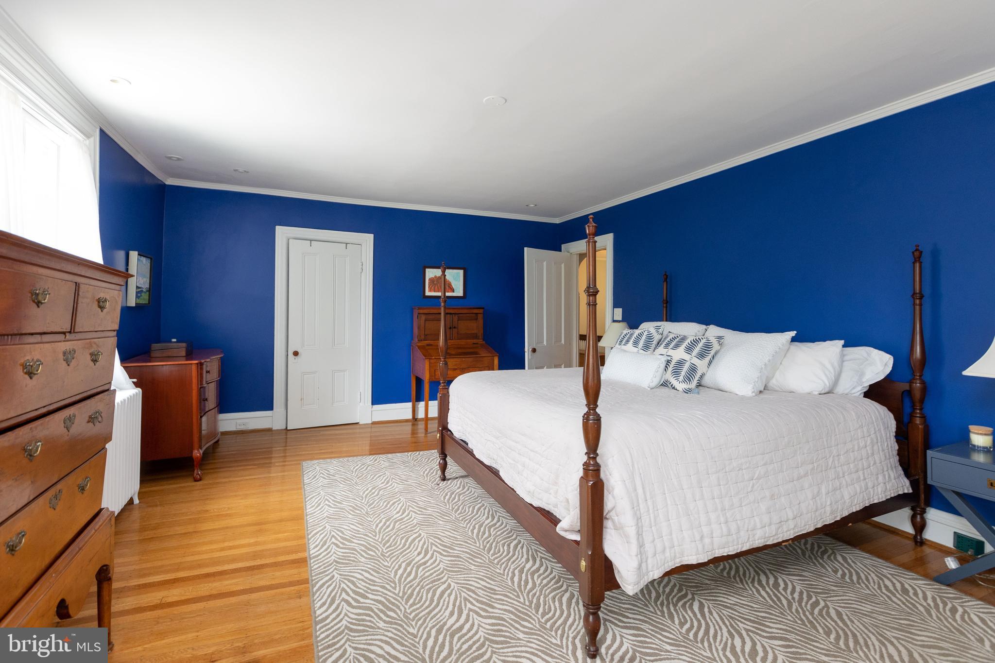 4711 Roland Avenue Baltimore, MD 21210 - Photo 38 of 68 a bed room with a bed and a chair