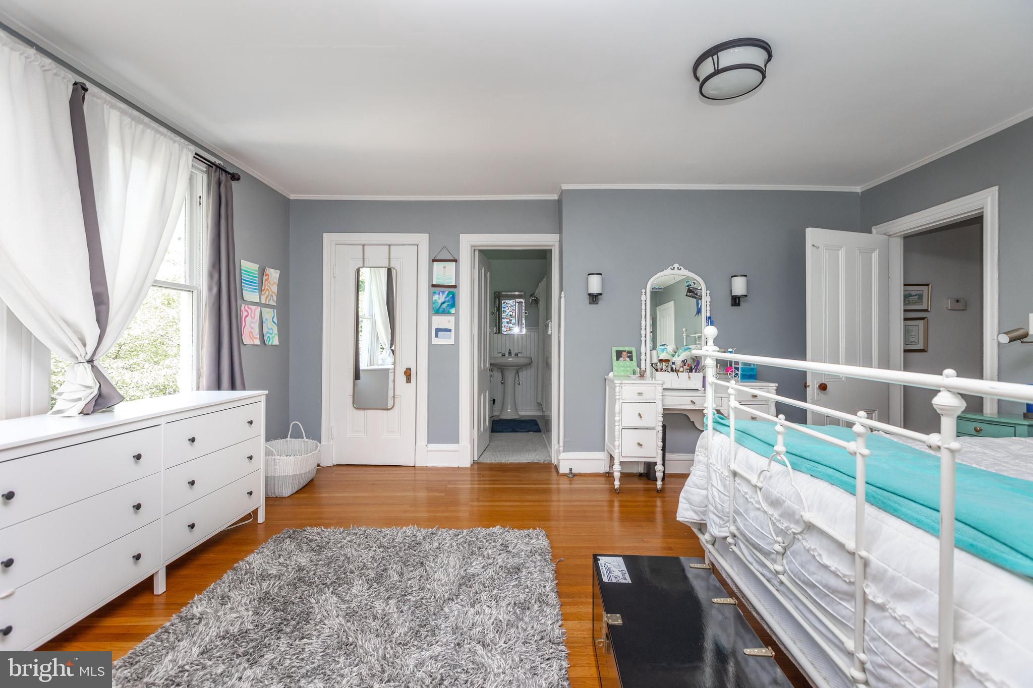 4711 Roland Avenue Baltimore, MD 21210 - Photo 43 of 68 a large spacious bathroom with mirror and window