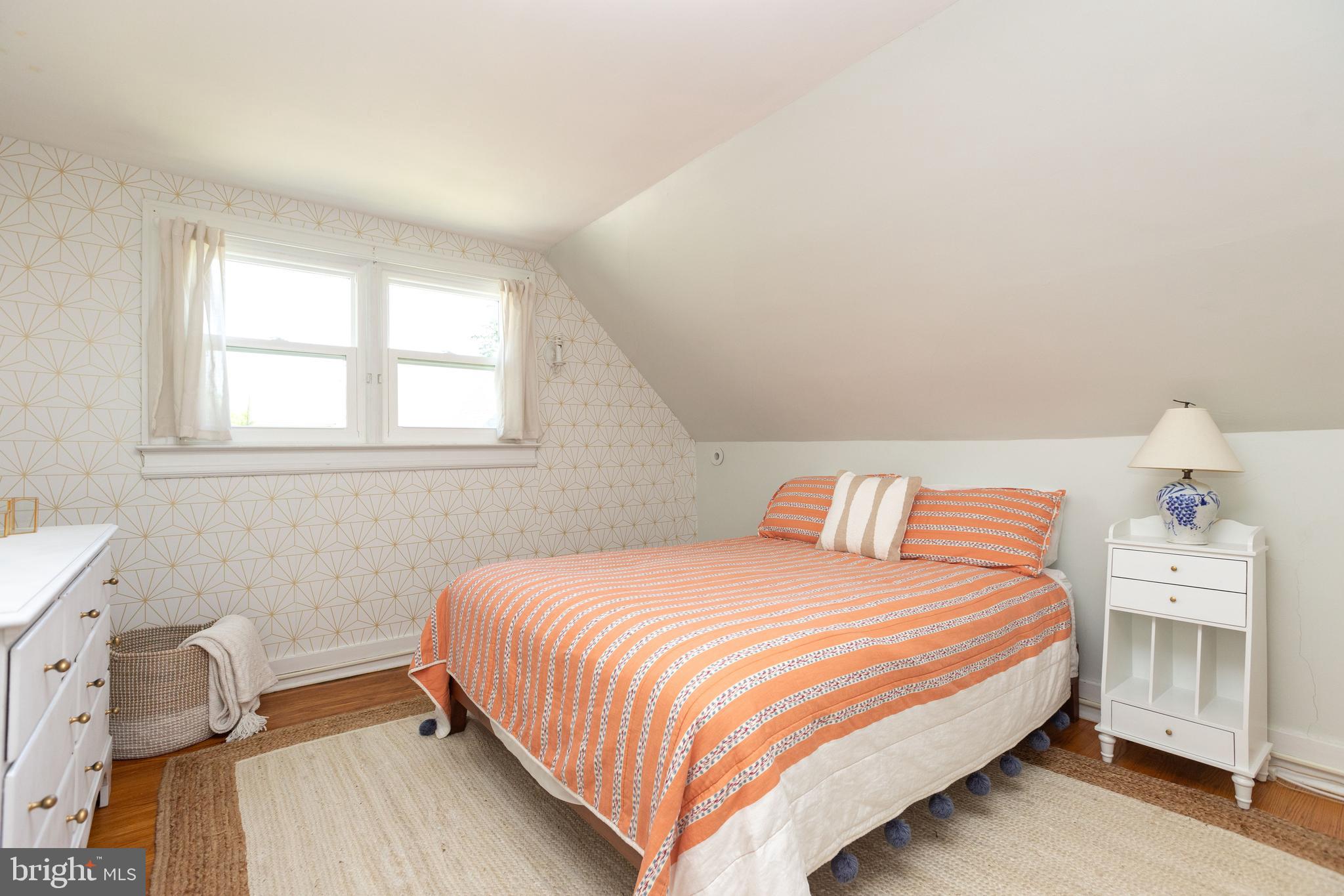 4711 Roland Avenue Baltimore, MD 21210 - Photo 56 of 68 a bedroom with a bed and a window