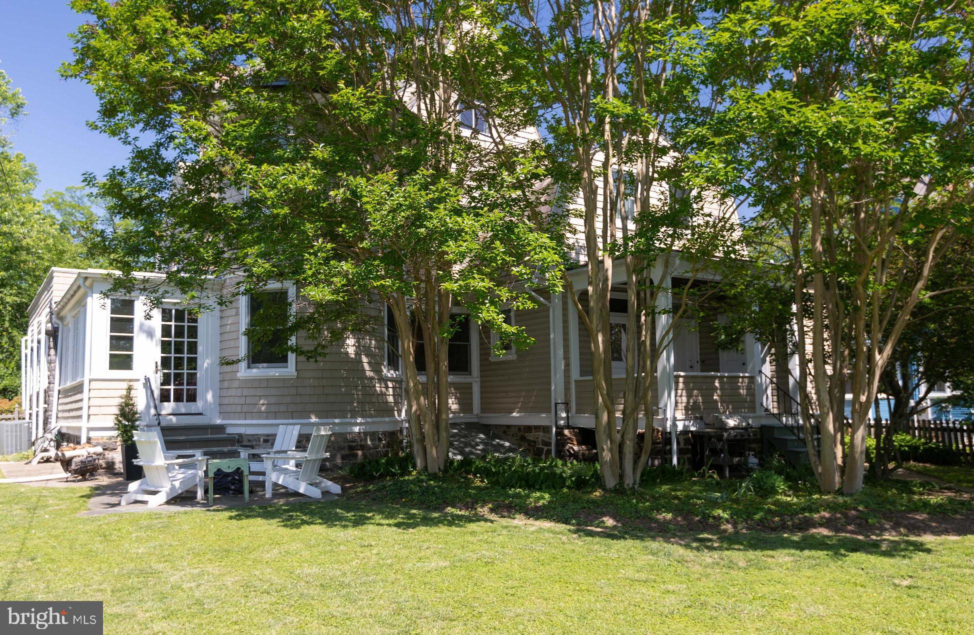 4711 Roland Avenue Baltimore, MD 21210 - Photo 62 of 68 a view of swimming pool with outdoor seating and trees