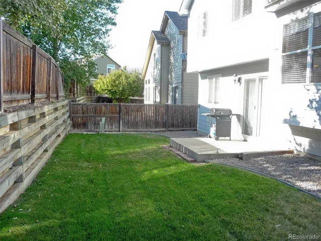 a view of a backyard with a garden and plants