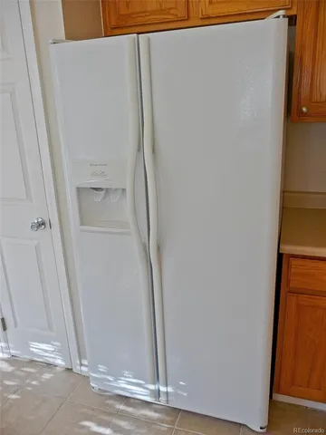 a view of a storage & utility room with a door