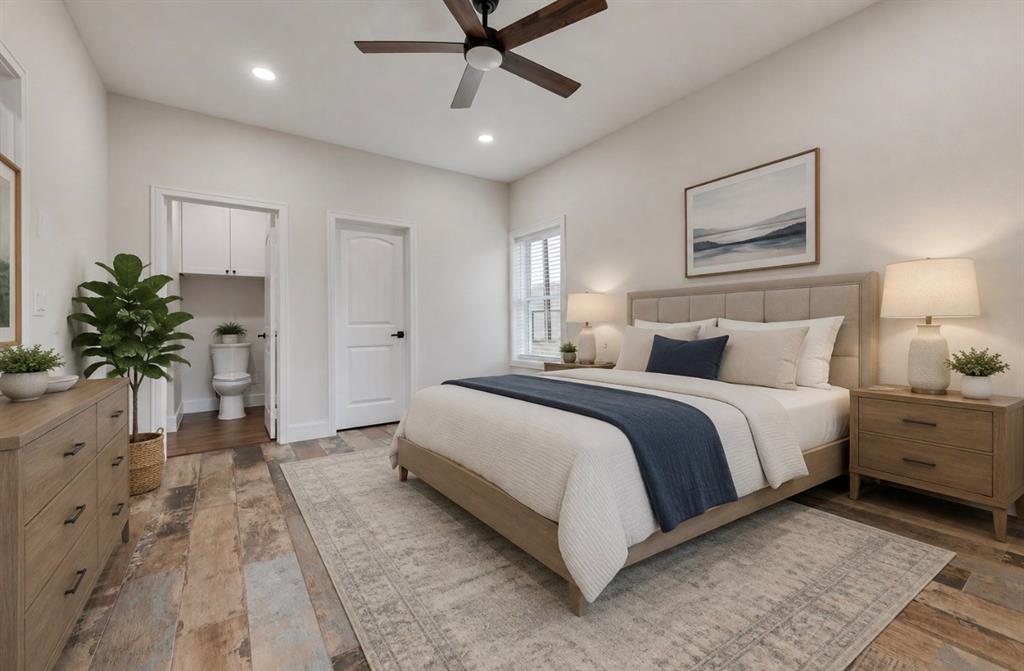 11167 Plainview Road Krum, TX 76249 - Photo 33 of 40 downstairs bedroom virtually staged. Has en-suite bathroom.