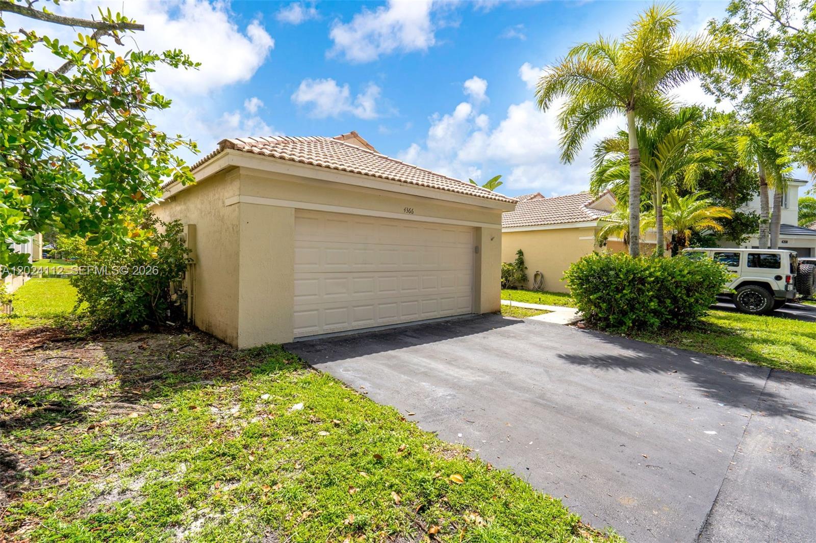 4366 Mahogany Ridge Drive Weston, FL 33331 - Photo 2 of 41 a view of backyard of house and trees
