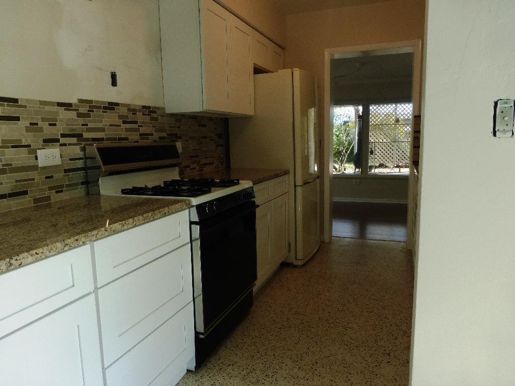 1607 High Ridge Road Lake Worth, FL 33461 - Photo 35 of 45 Kitchen leads to Fam. Rm.