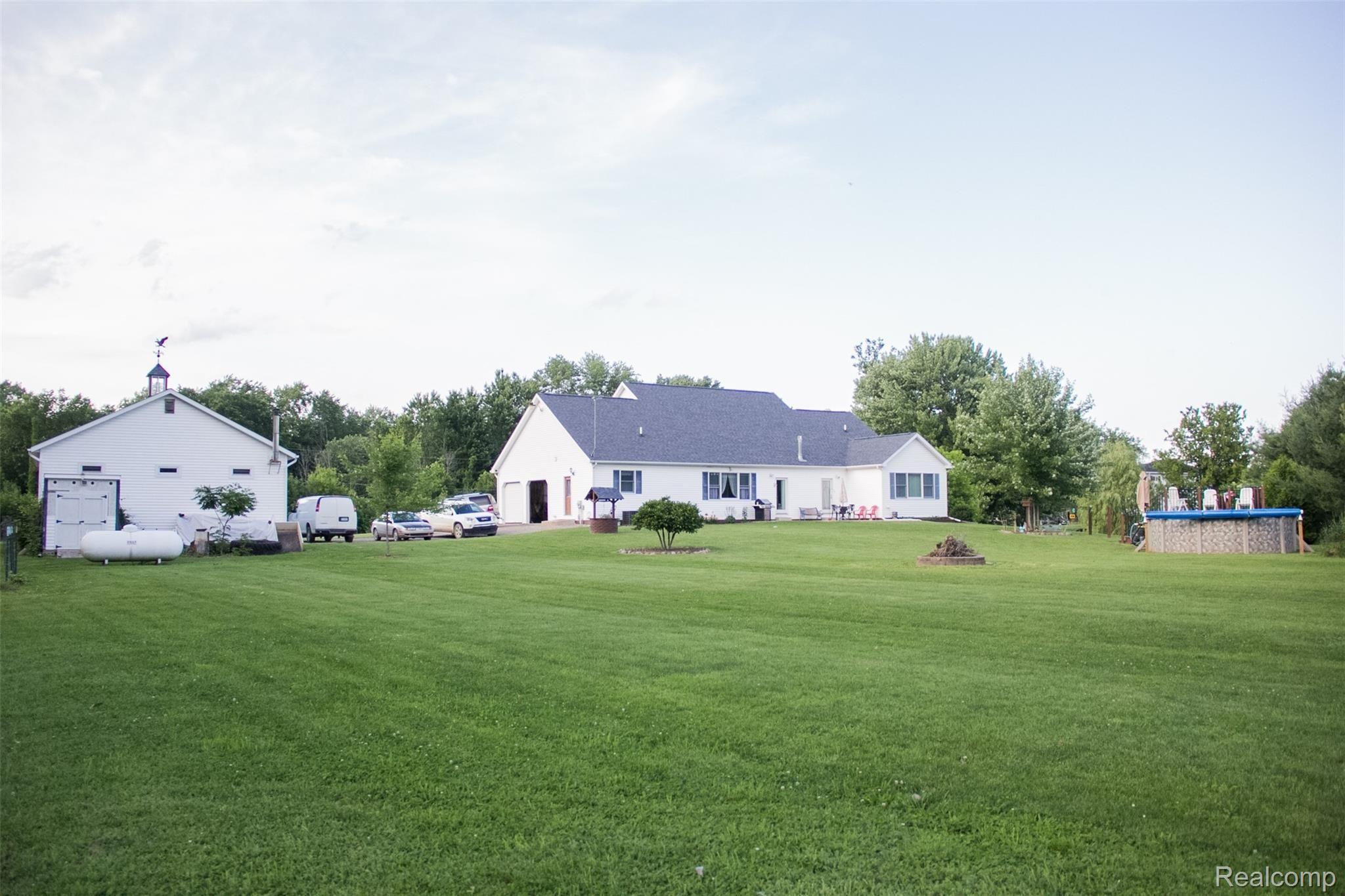 11089 West Mohrle Road Webberville, MI 48892 - Photo 3 of 31 Beautifully Manicured Rear Yard - Note: 40 x 30 Heated Pole Barn.