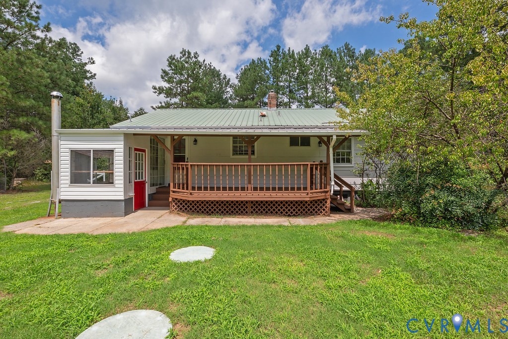 20100 Frog Level Road Ruther Glen, VA 22546 - Photo 20 of 28 Expansive backyard with a manicured lawn, an exten
