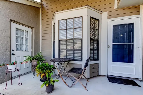 a building outdoor space with porch and furniture