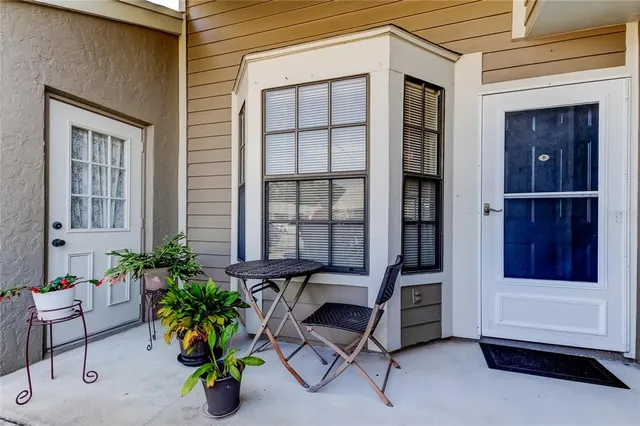 a building outdoor space with porch and furniture