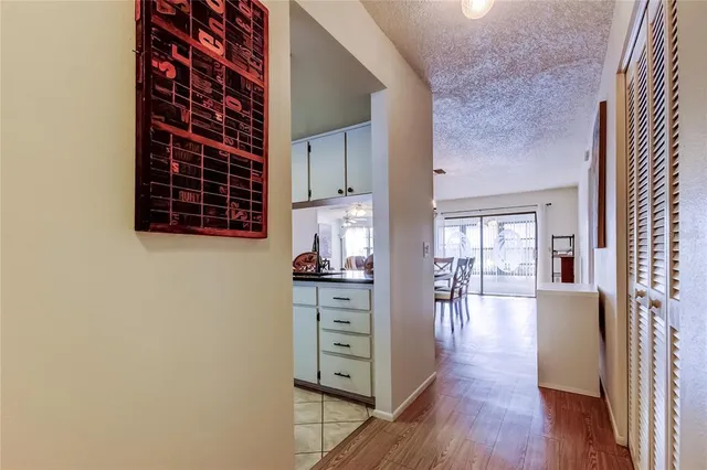 wooden floor in a hall with a large window