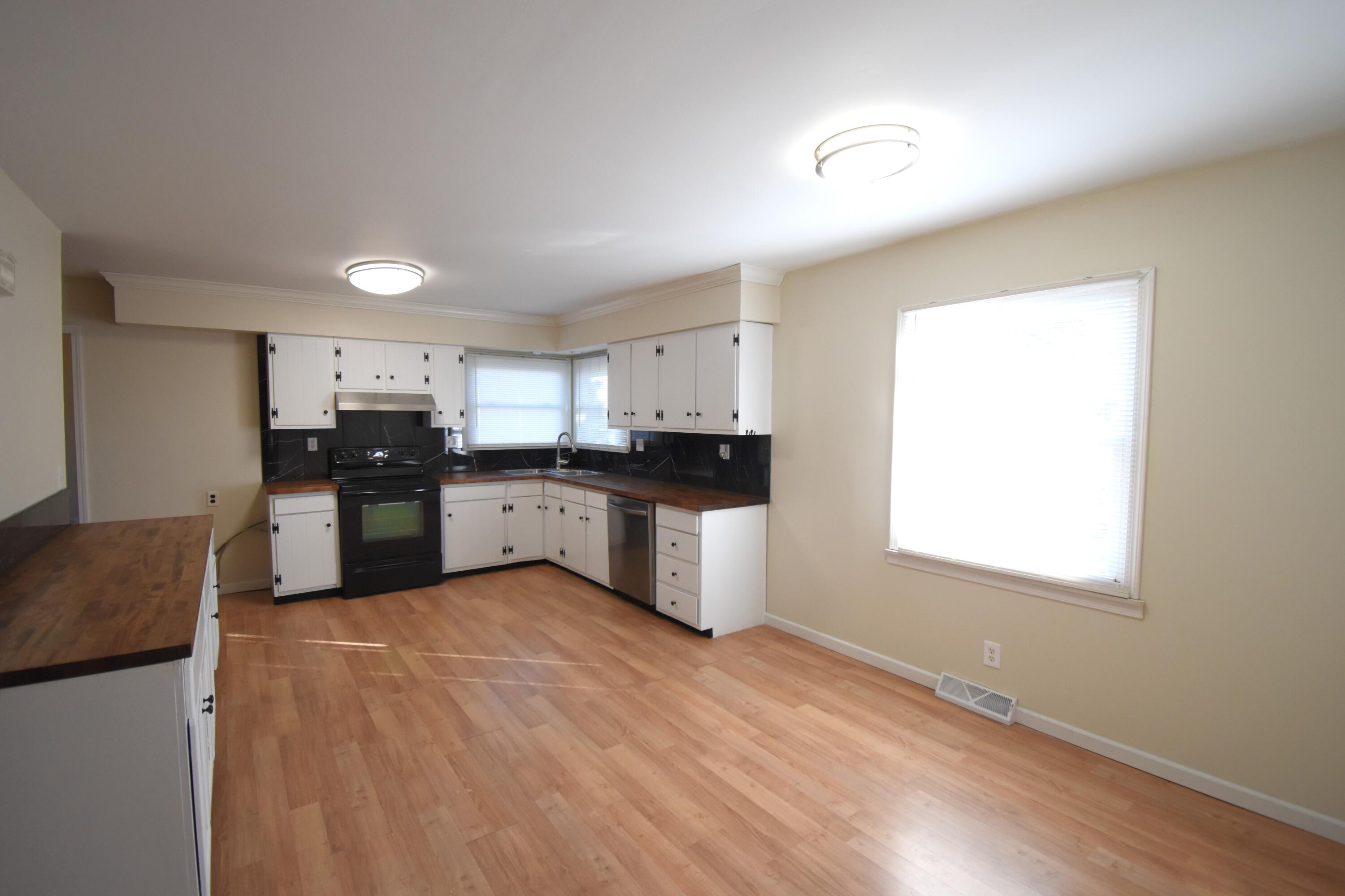 360 East Arnotts Drive Rensselaer, IN 47978 - Photo 13 of 39 a large kitchen with stainless steel appliances granite countertop a stove a sink and a refrigerator